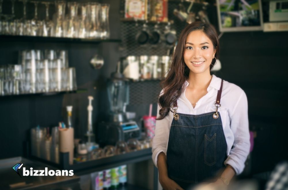 The-Benefits-of-Getting-a-Cash-Flow-Loan happy business woman in coffee shop