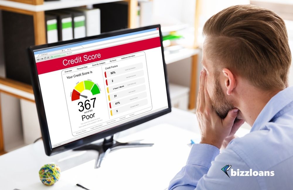 10-effective-ways-to-improve-your-business-credit-score business man looking at his Poor Online Credit Score Rating On Computer