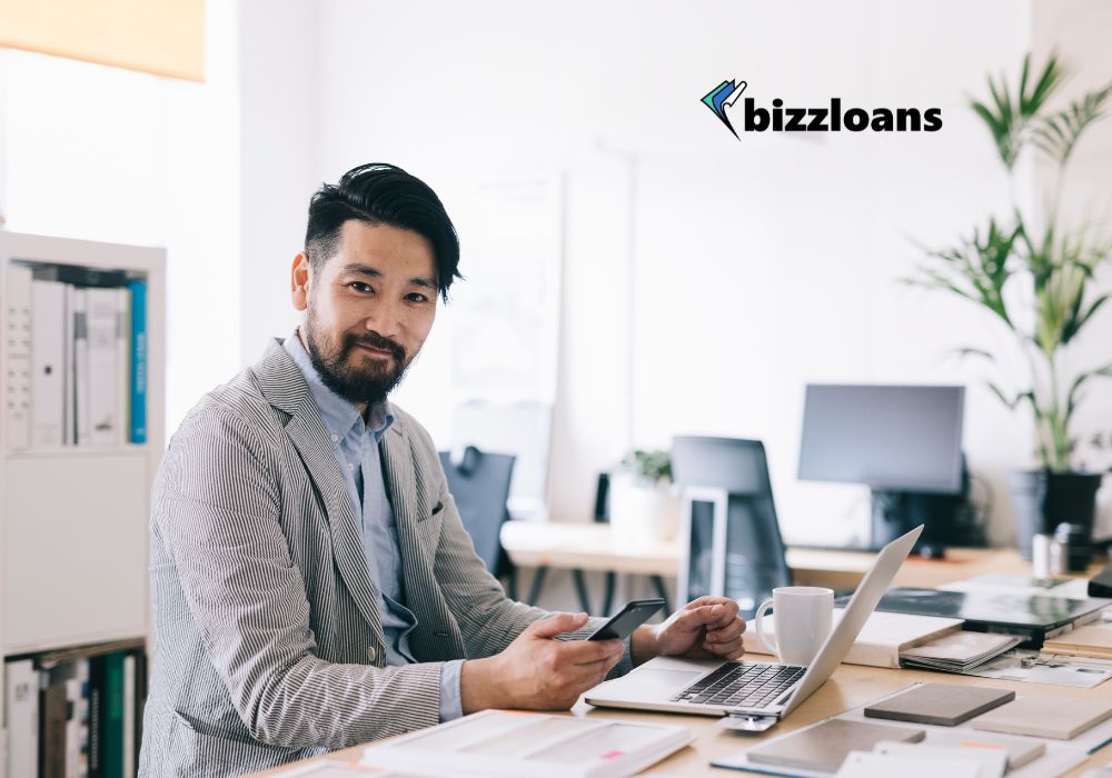 easy-street-unraveling-the-easiest-loans-to-get-in-australia happy business owner on laptop; business loan concept