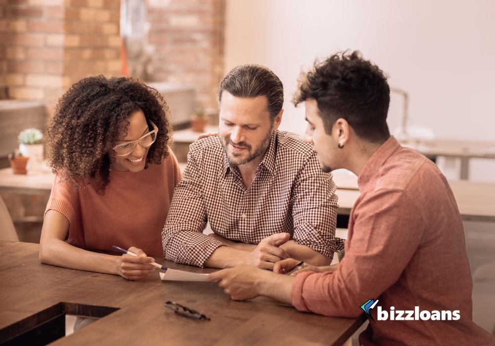 people-behind-the-money-getting-to-know-your-business-loan-lenders business loan lenders and business owner discussing about a loan